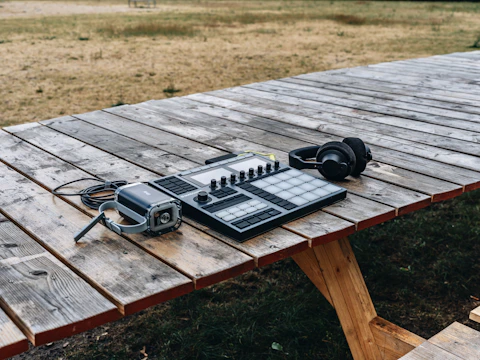 Audio equipment setup at an outdoor event with speakers and mixers.