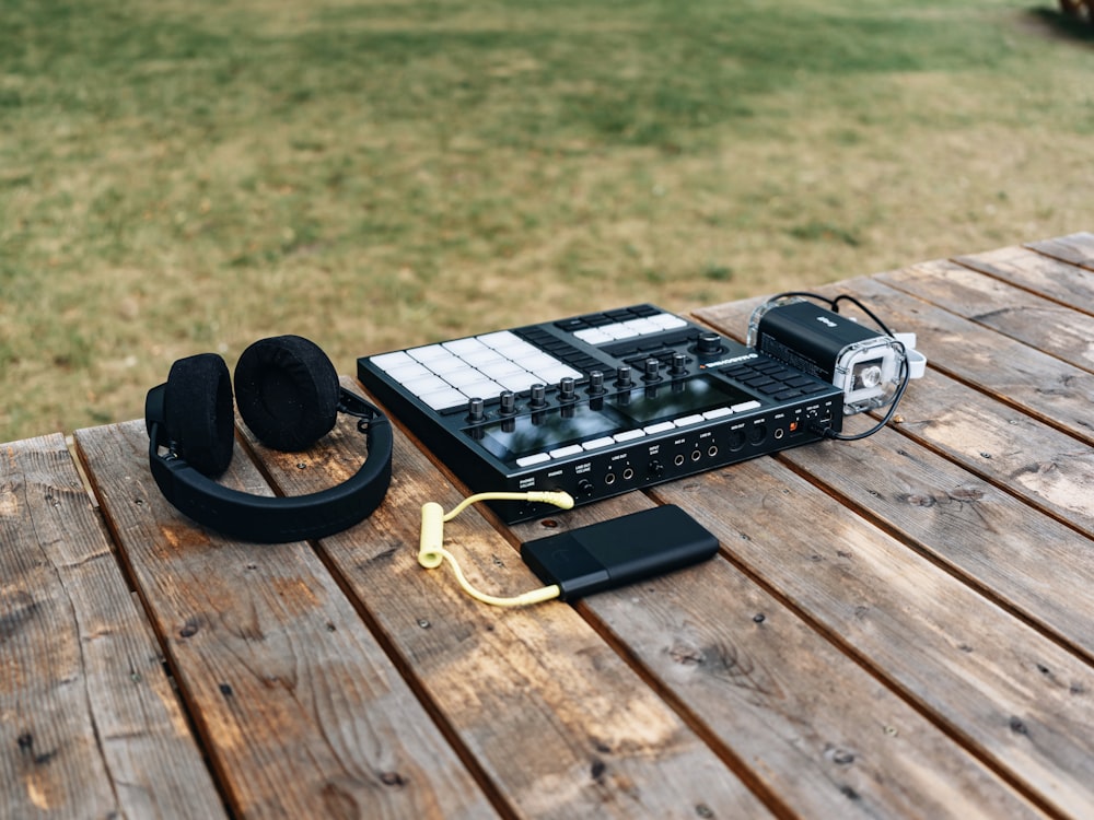 a pair of headphones sitting on top of a wooden table