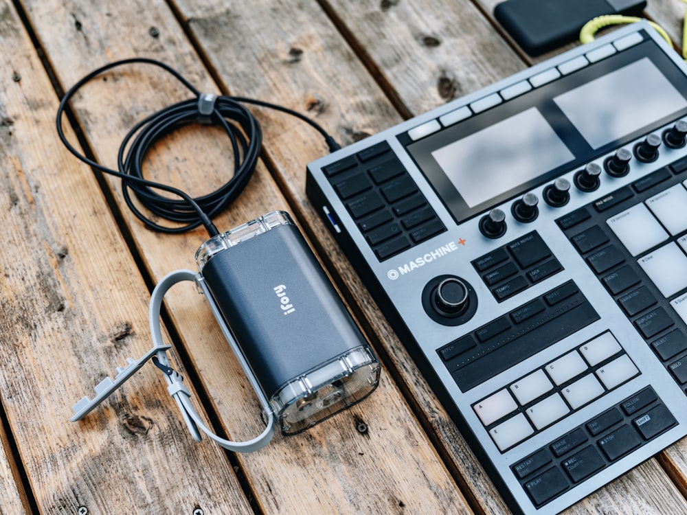 an electronic device sitting on top of a wooden table