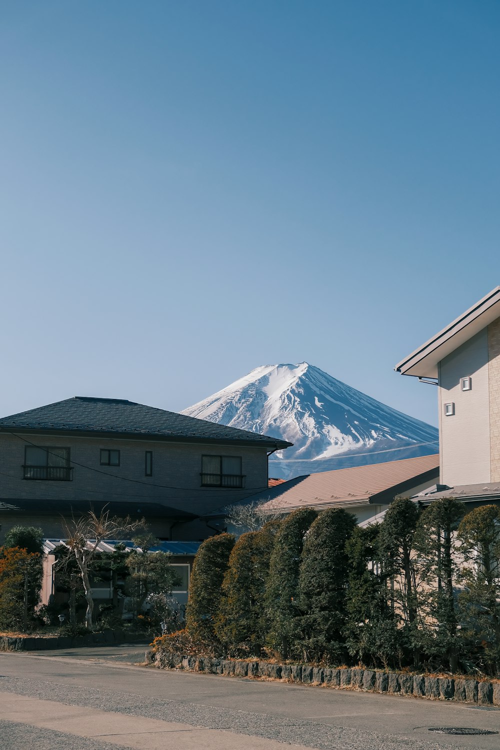 a house with a mountain in the background