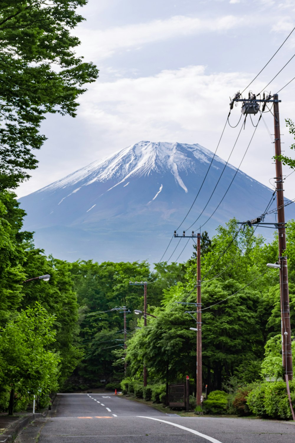 a road with a mountain in the background