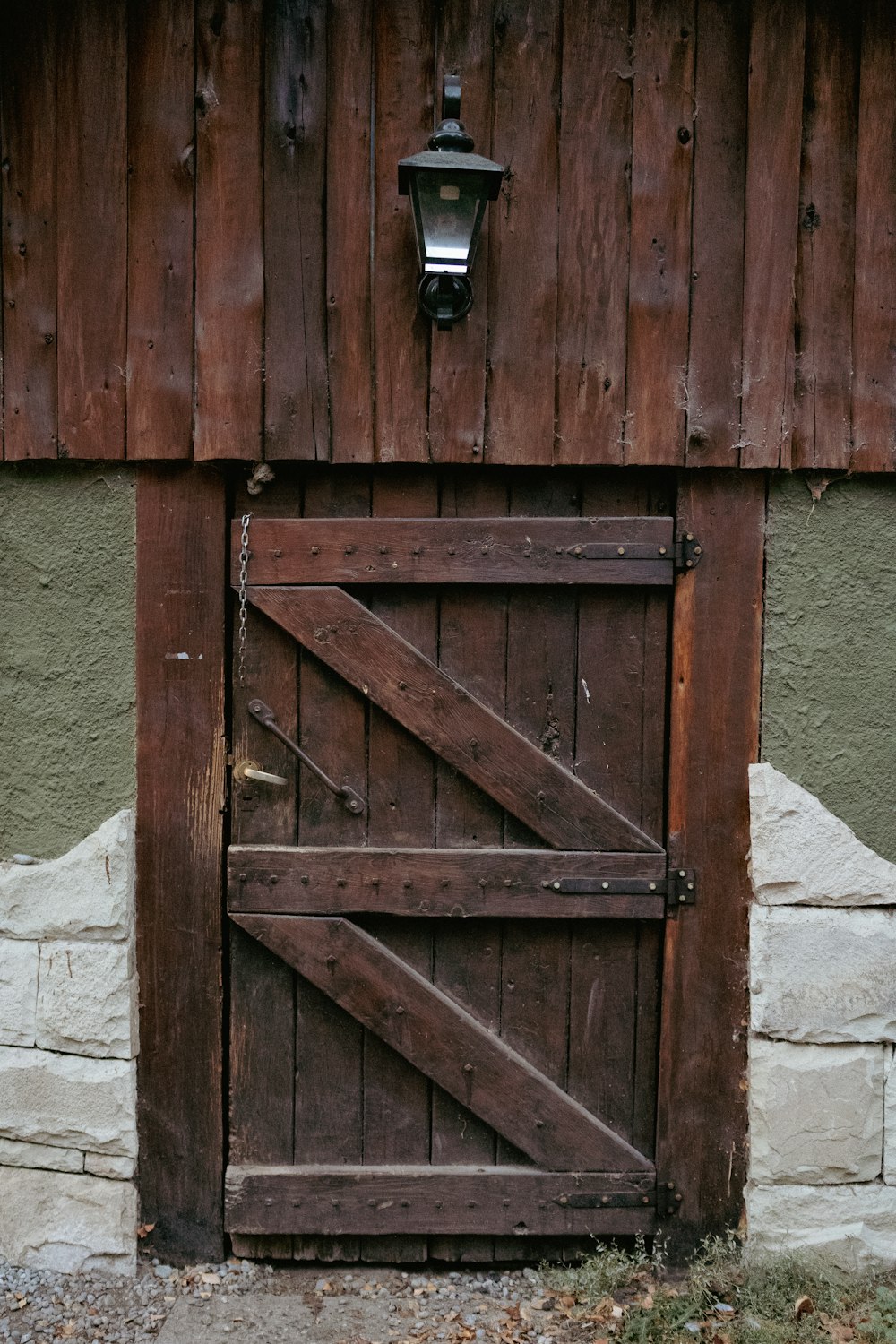 a barn door with a light on the side of it