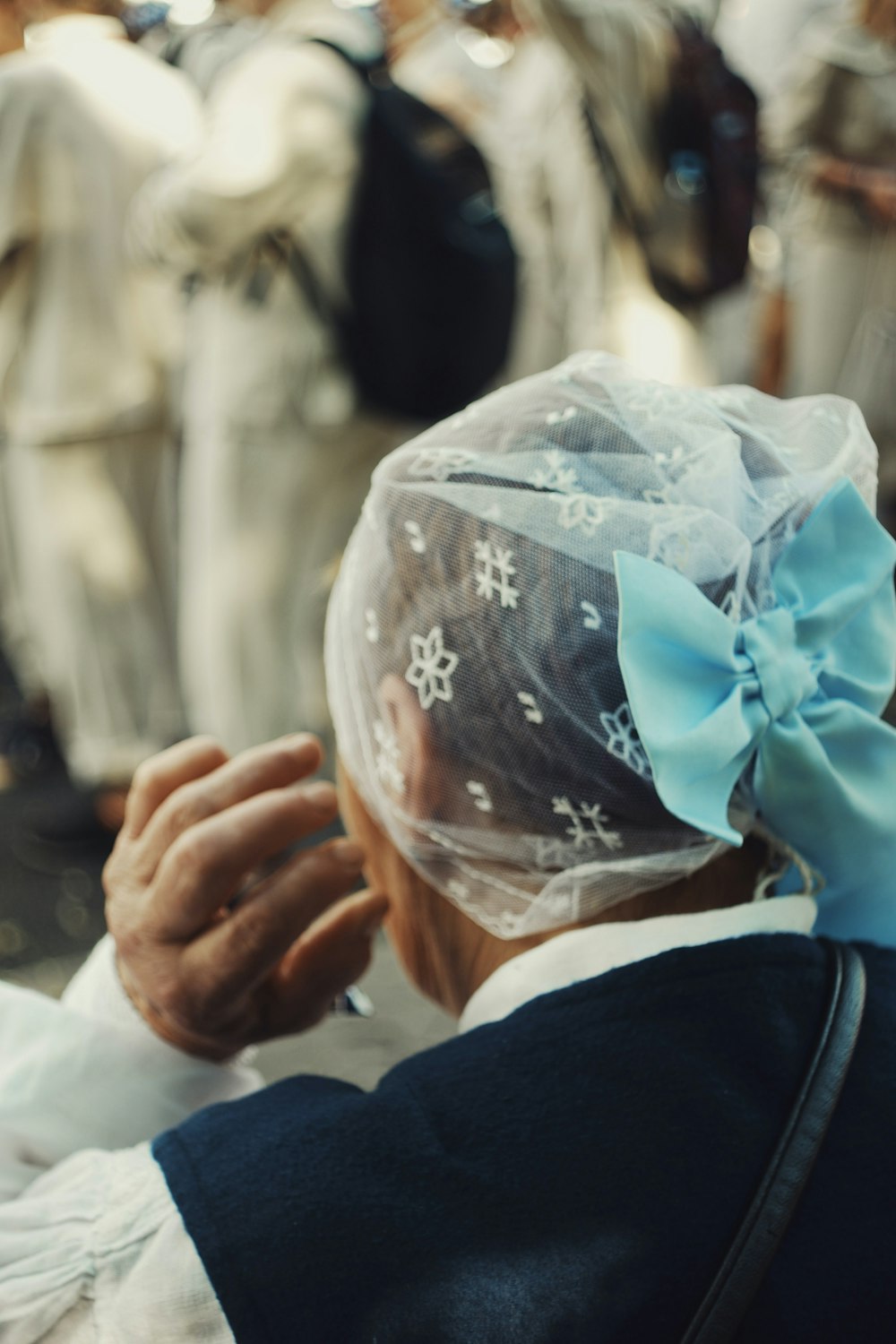 a man in a suit and a blue bow tie