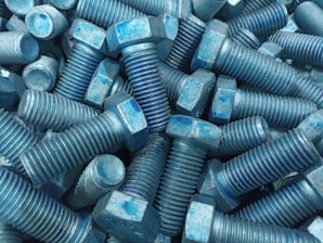 Finished bolts neatly stacked after passing through the trimming process | Samrat