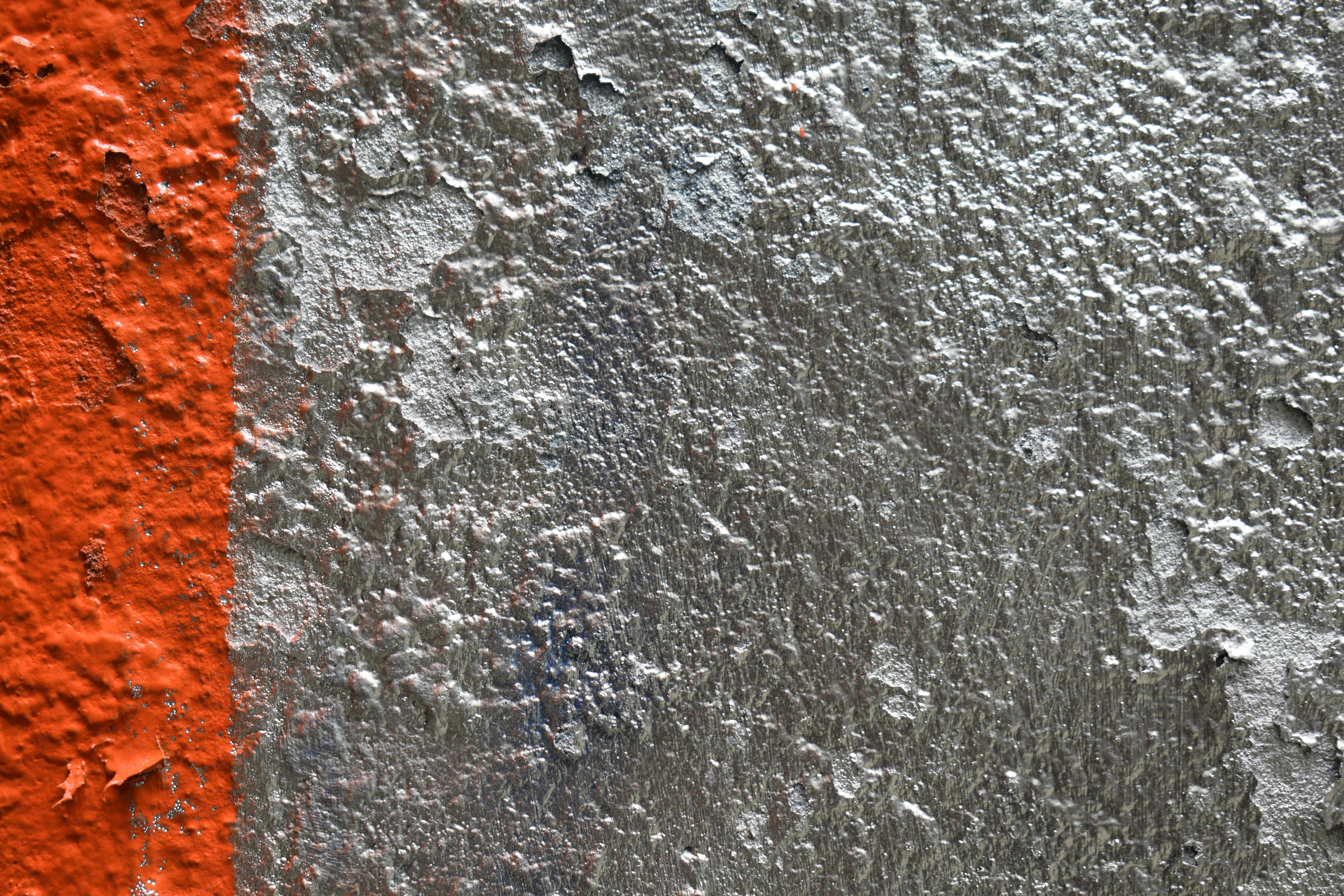 a close up of a wall with some paint on it