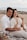 A couple relaxing on a beach after a guided tour.