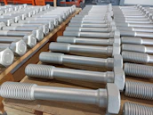 Rows of various industrial bearings arranged neatly on metal shelves in a warehouse.