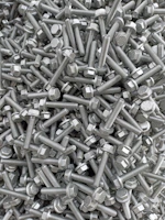 A vibrant display of colorful screws and bolts arranged in a spiral pattern
