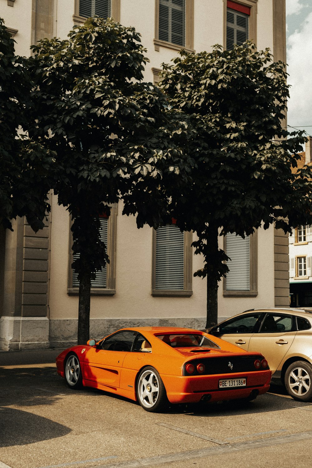 two cars parked in front of a building