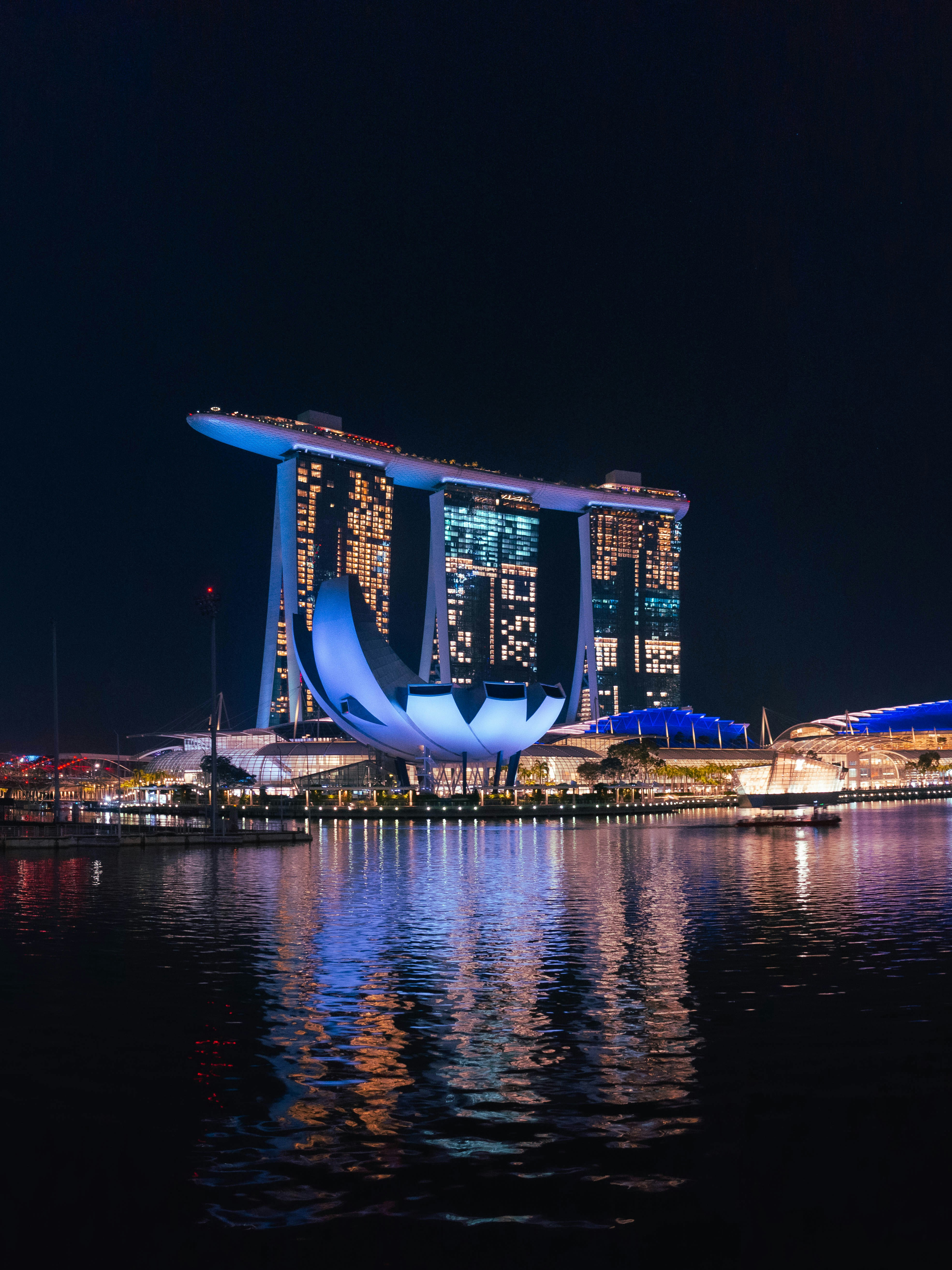 a large body of water with a city in the background