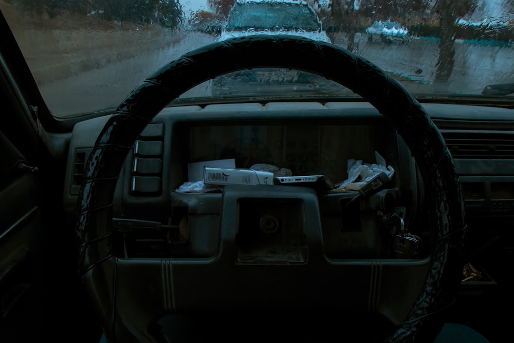 a car dashboard with a steering wheel in it