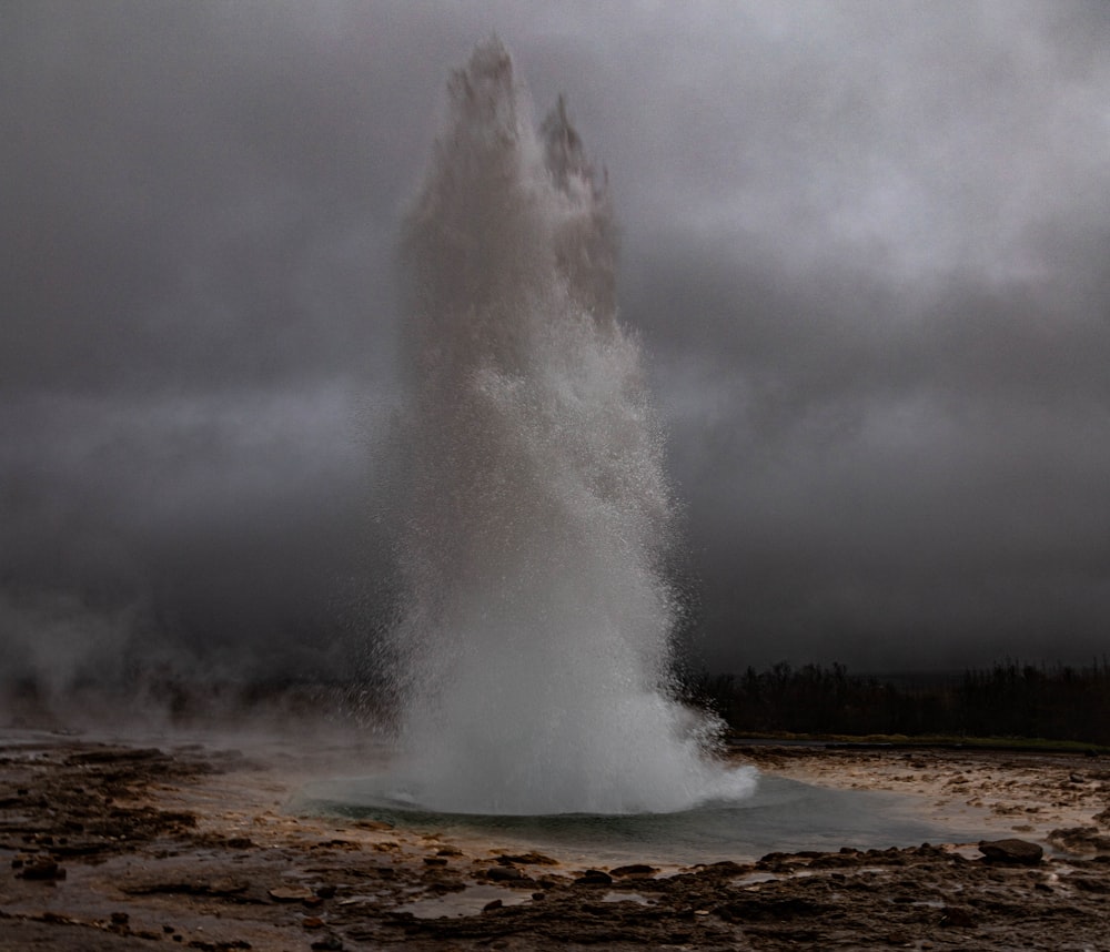 a geyser spewing out water into the air