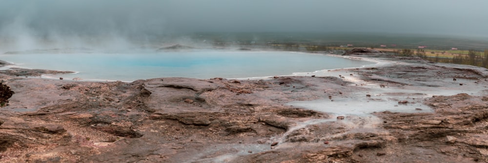 a large pool of water surrounded by rocks