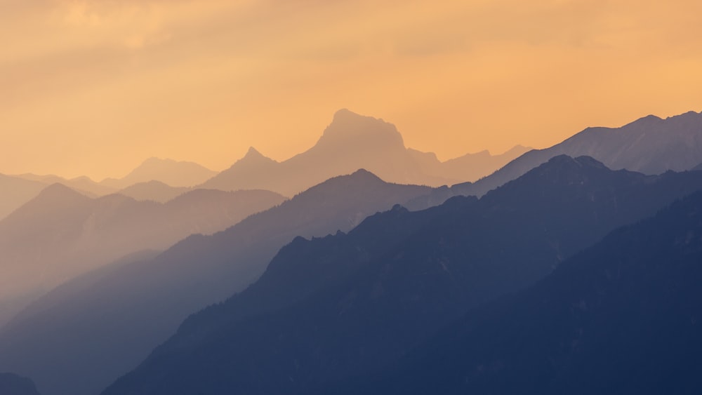 a view of a mountain range at sunset