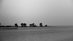 Black and white photo of a serene landscape with soft contrasts and calm mood.