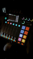 A sleek mixing console with colorful sound waves emanating, showing dynamic audio branding creation.