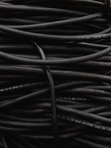 a pile of black wires sitting on top of each other