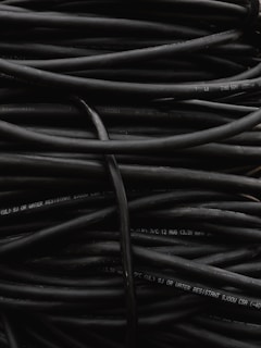 a pile of black wires sitting on top of each other