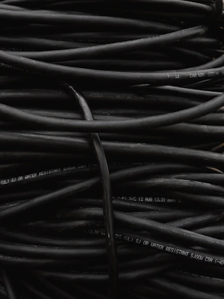 a pile of black wires sitting on top of each other