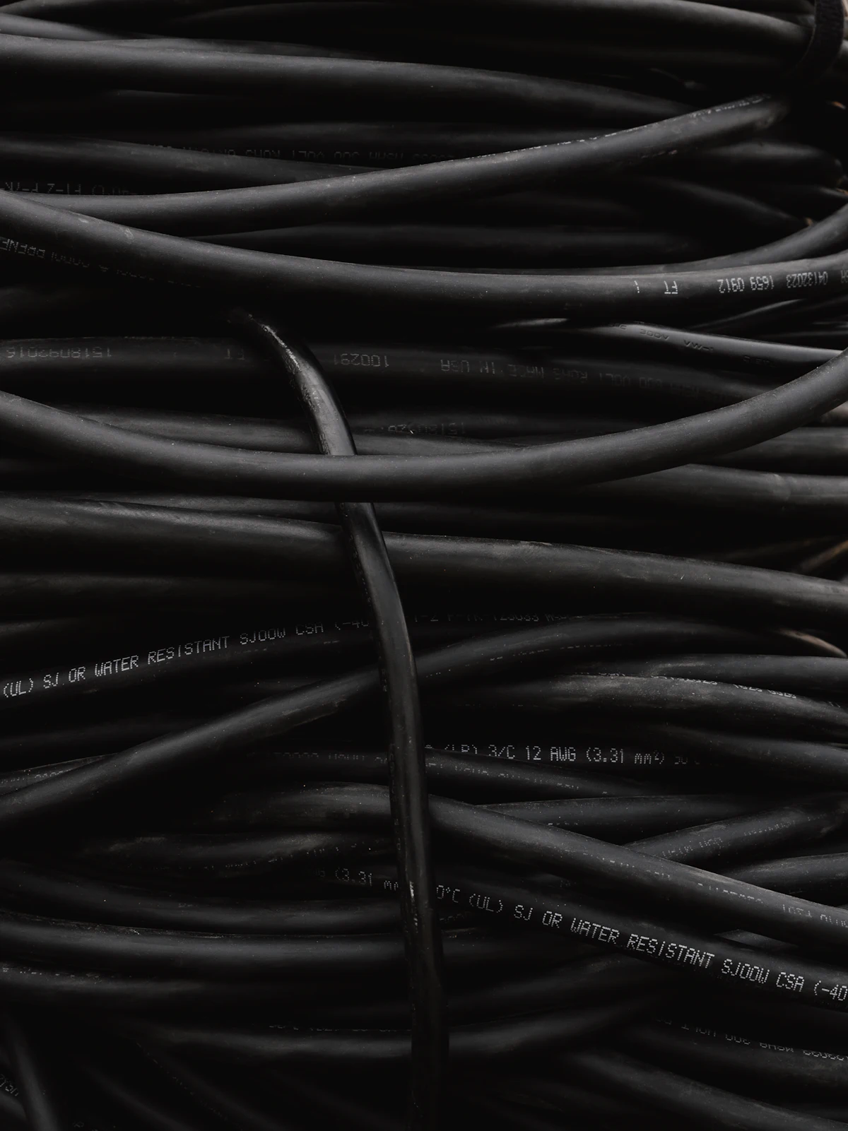 Coils of black coaxial cable ready for an antenna installation