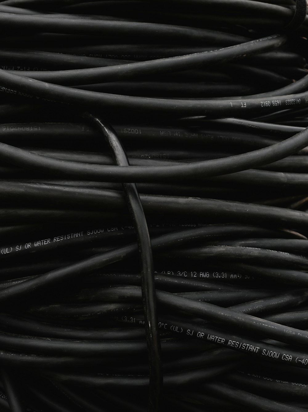 a pile of black wires sitting on top of each other