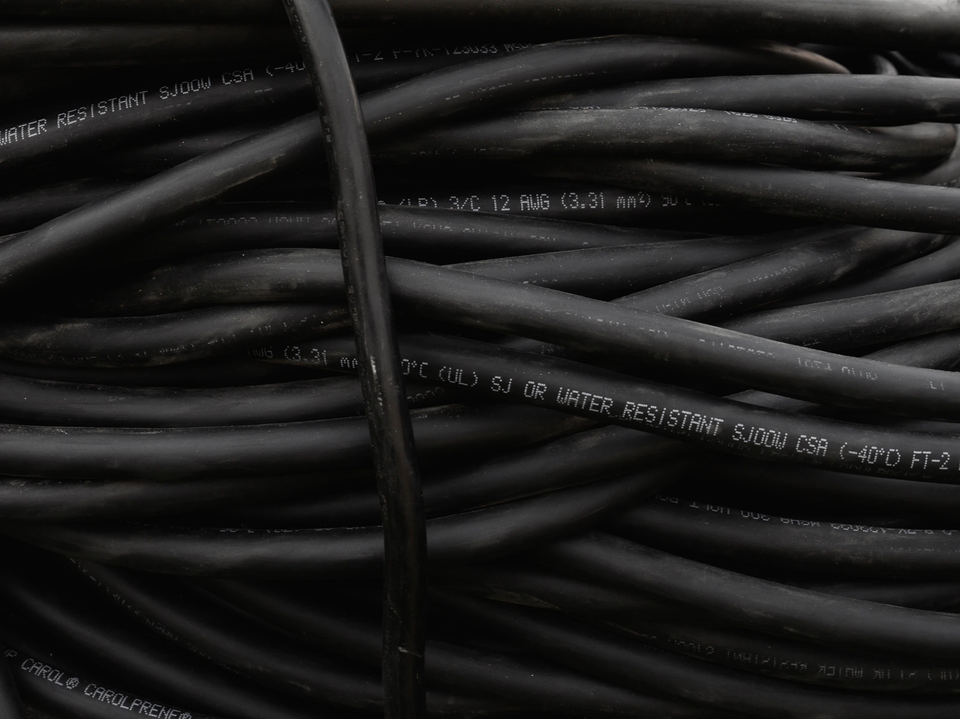 a bunch of black wires are stacked together