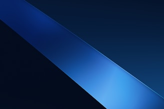 A sleek, diagonal blue gradient stripe crosses from the bottom left to the top right against a darker blue background, creating a minimalist and modern aesthetic.