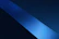 A sleek, minimal portrait of a confident creative professional against a deep blue gradient background with subtle glowing accents.