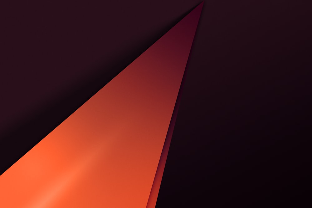 an orange and black triangle on a black background