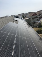 Rooftop installation of Rescomm Solar panels on a sunny suburban home.