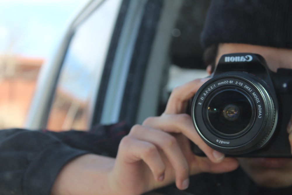 a man taking a picture of himself with a camera