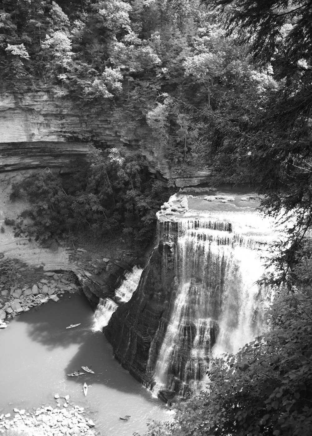 a black and white photo of a waterfall