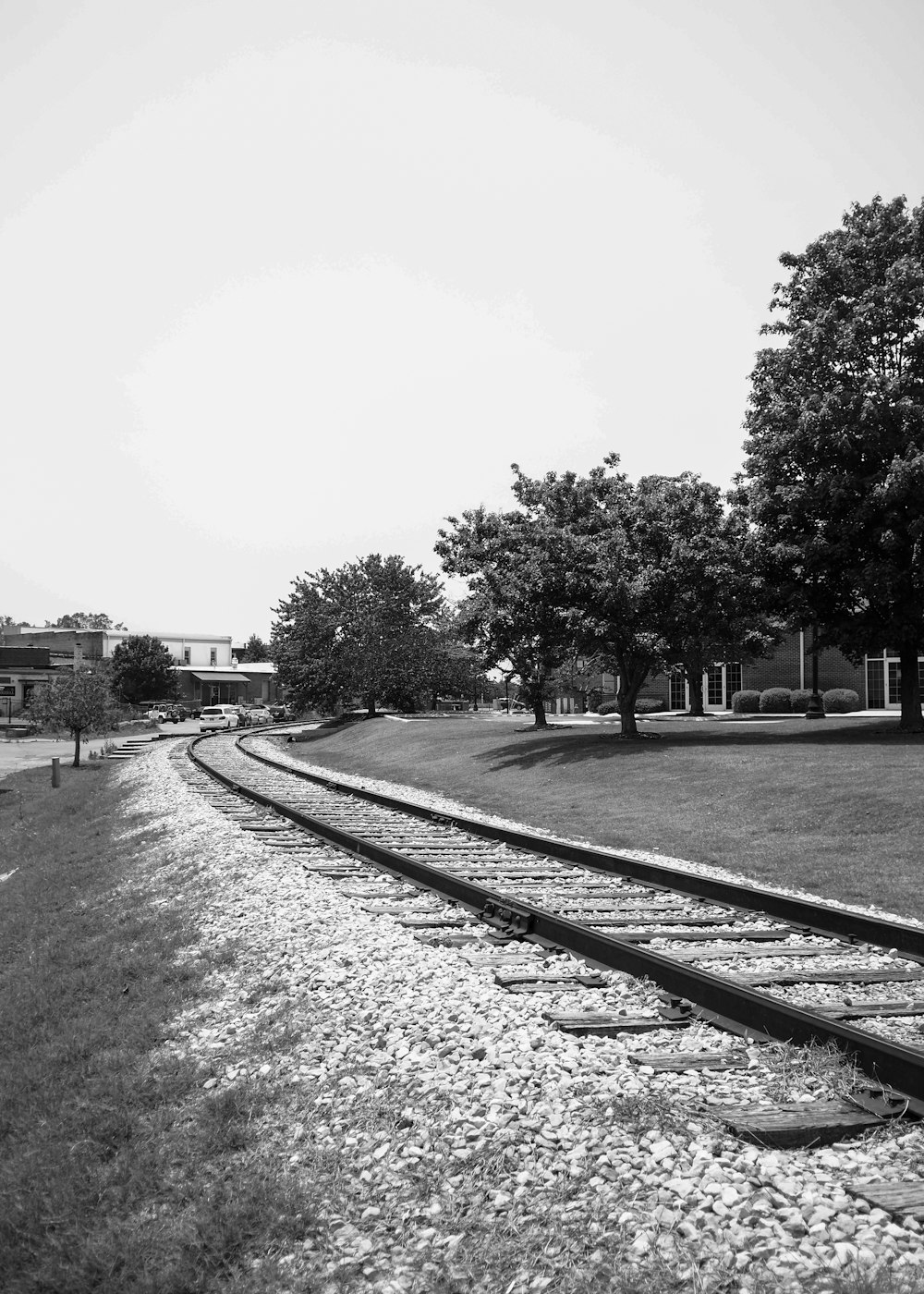 a black and white photo of a train track