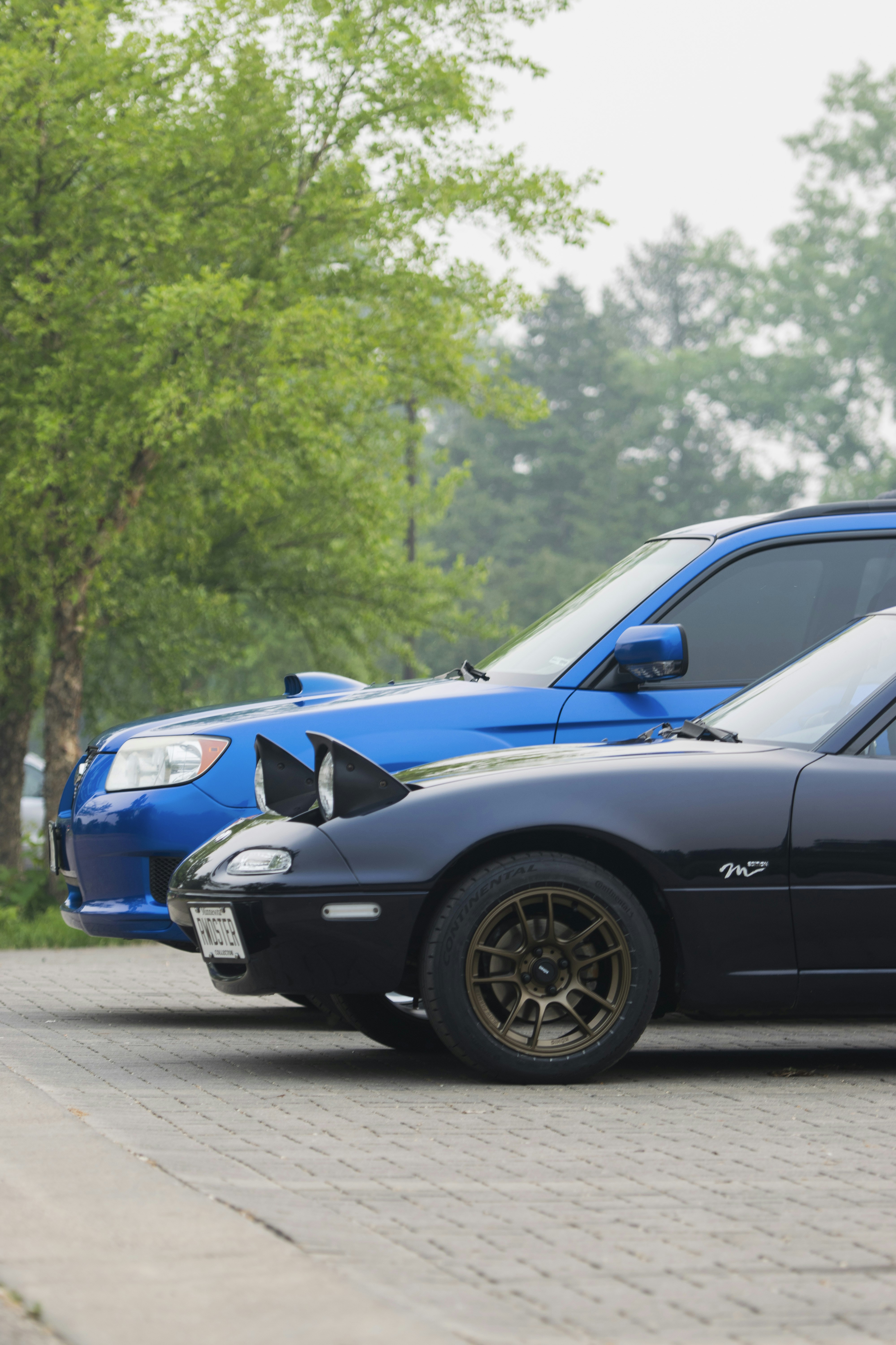a couple of cars parked next to each other