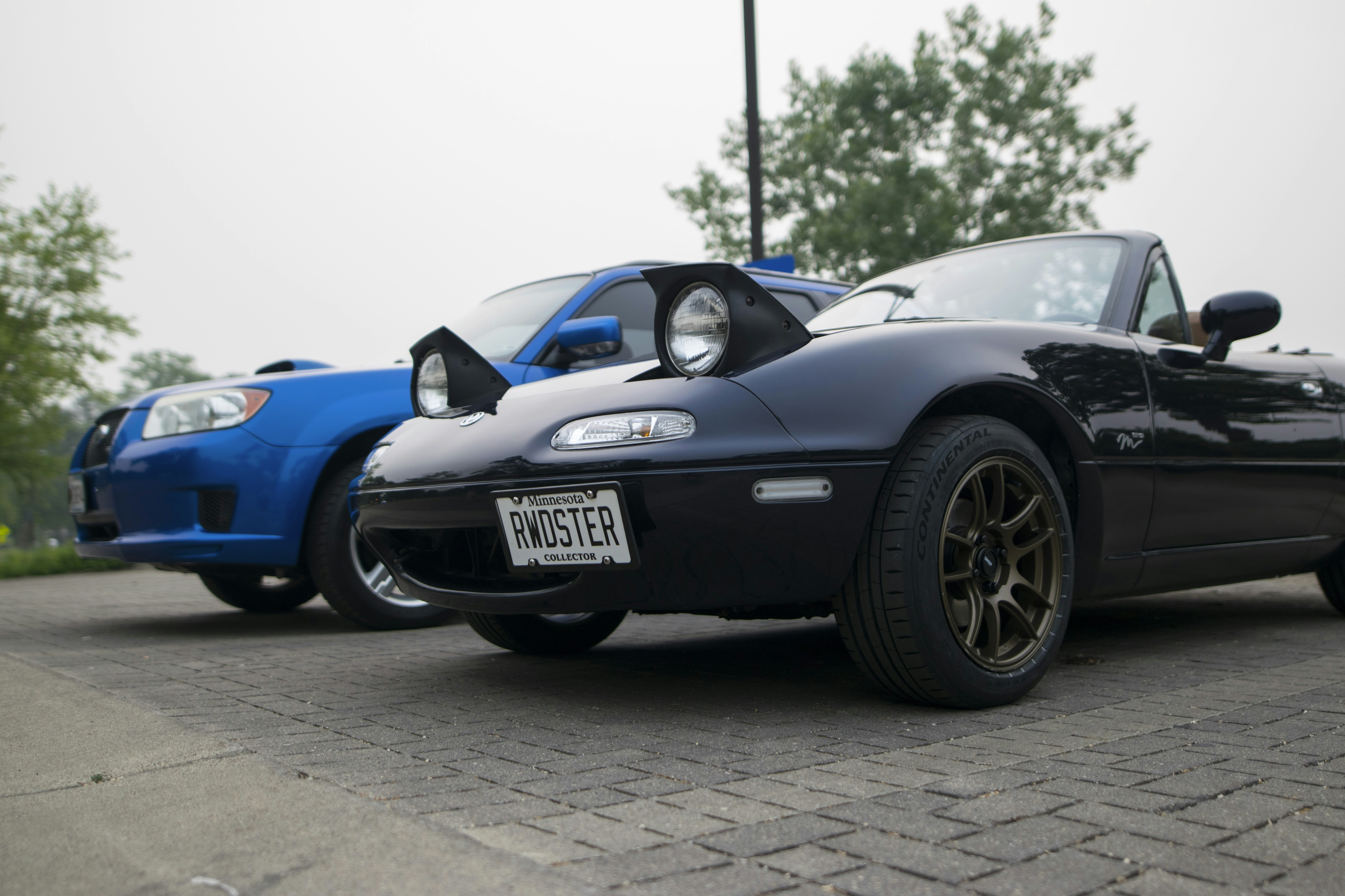 a couple of cars parked next to each other