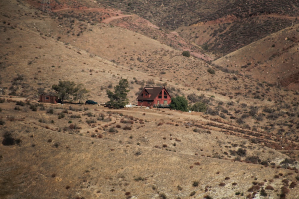 a house in the middle of a hilly area