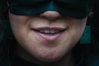 An Instagram-style snapshot of a smiling face partially hidden behind a quirky anxiety-themed mask.