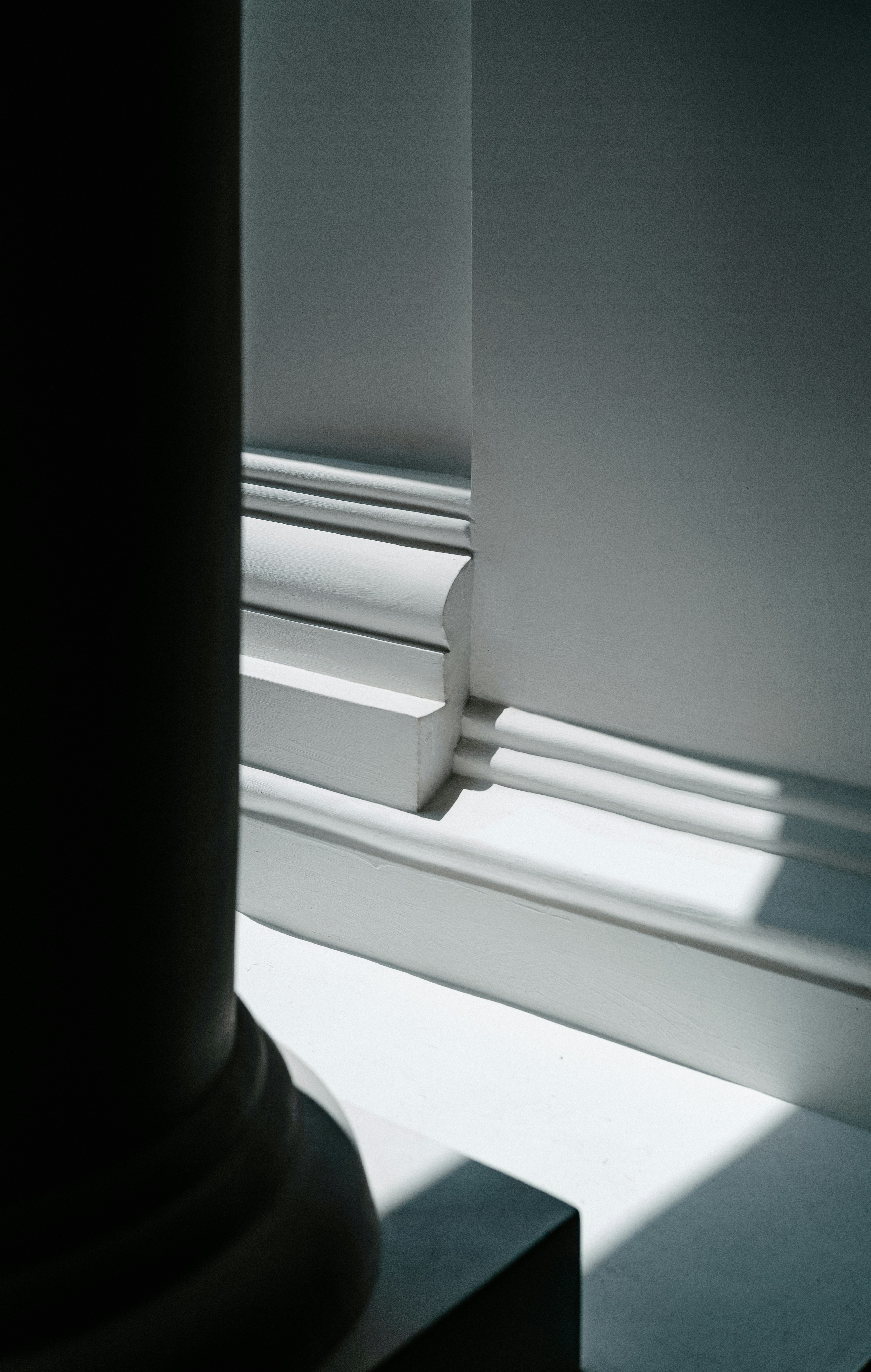 a black and white photo of a window sill