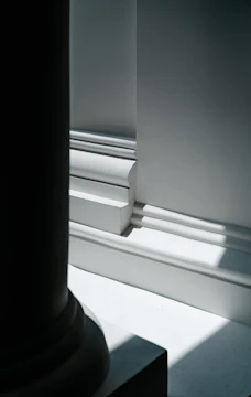 a black and white photo of a window sill