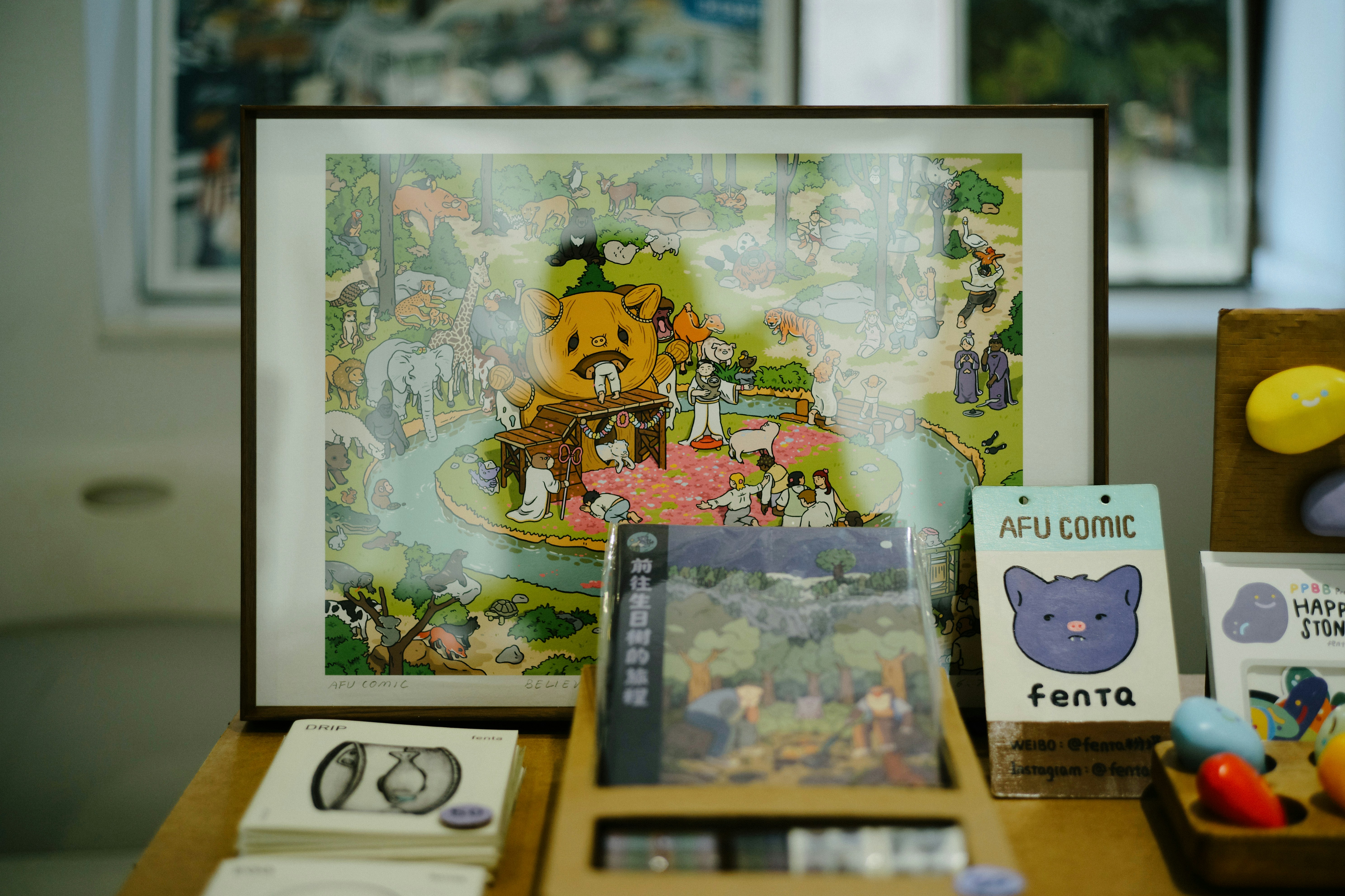a wooden table topped with a picture of a bear and other items