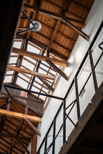 Finished wooden roof structure viewed from inside a house.