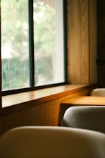 a row of chairs sitting in front of a window
