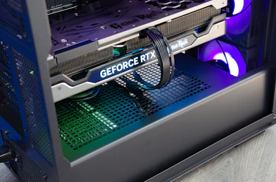 Close-up of a high-end graphics card being installed inside a custom PC case.