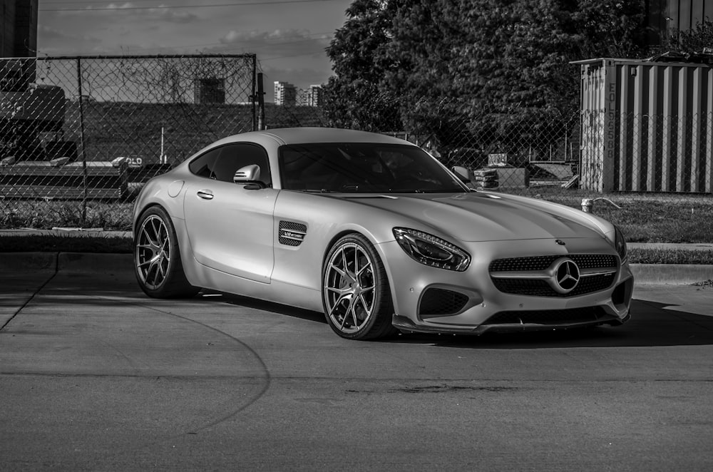 a silver sports car parked in a parking lot