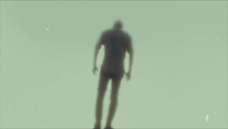 a blurry image of a person standing on a skateboard