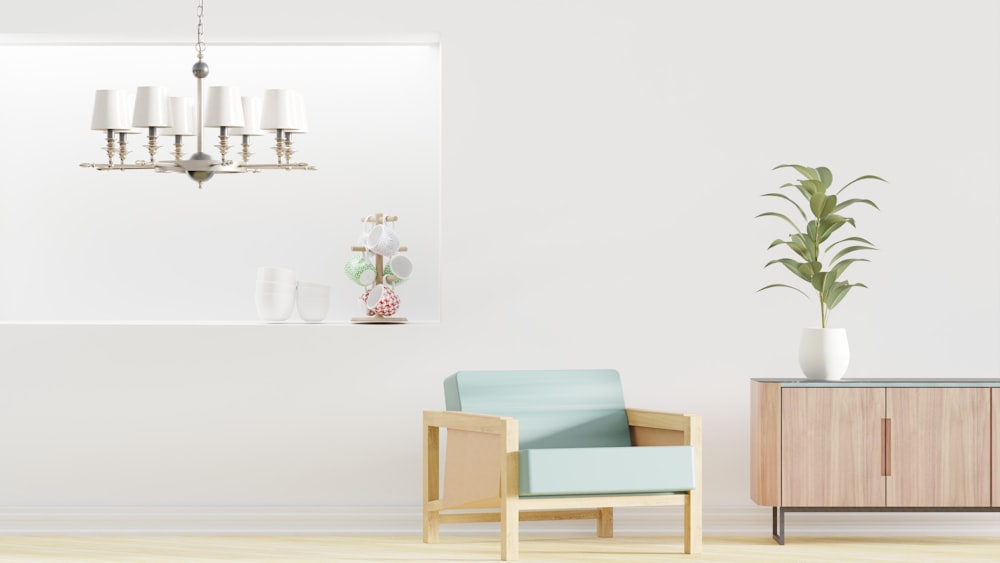 a living room with a blue chair and a wooden cabinet