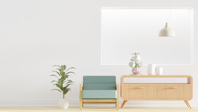 Salon minimaliste et bien organisé avec une plante un fauteuil bleu en bois et une console élégante