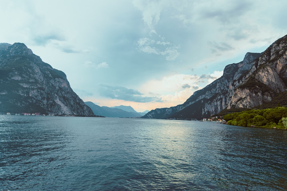 a body of water with mountains in the background