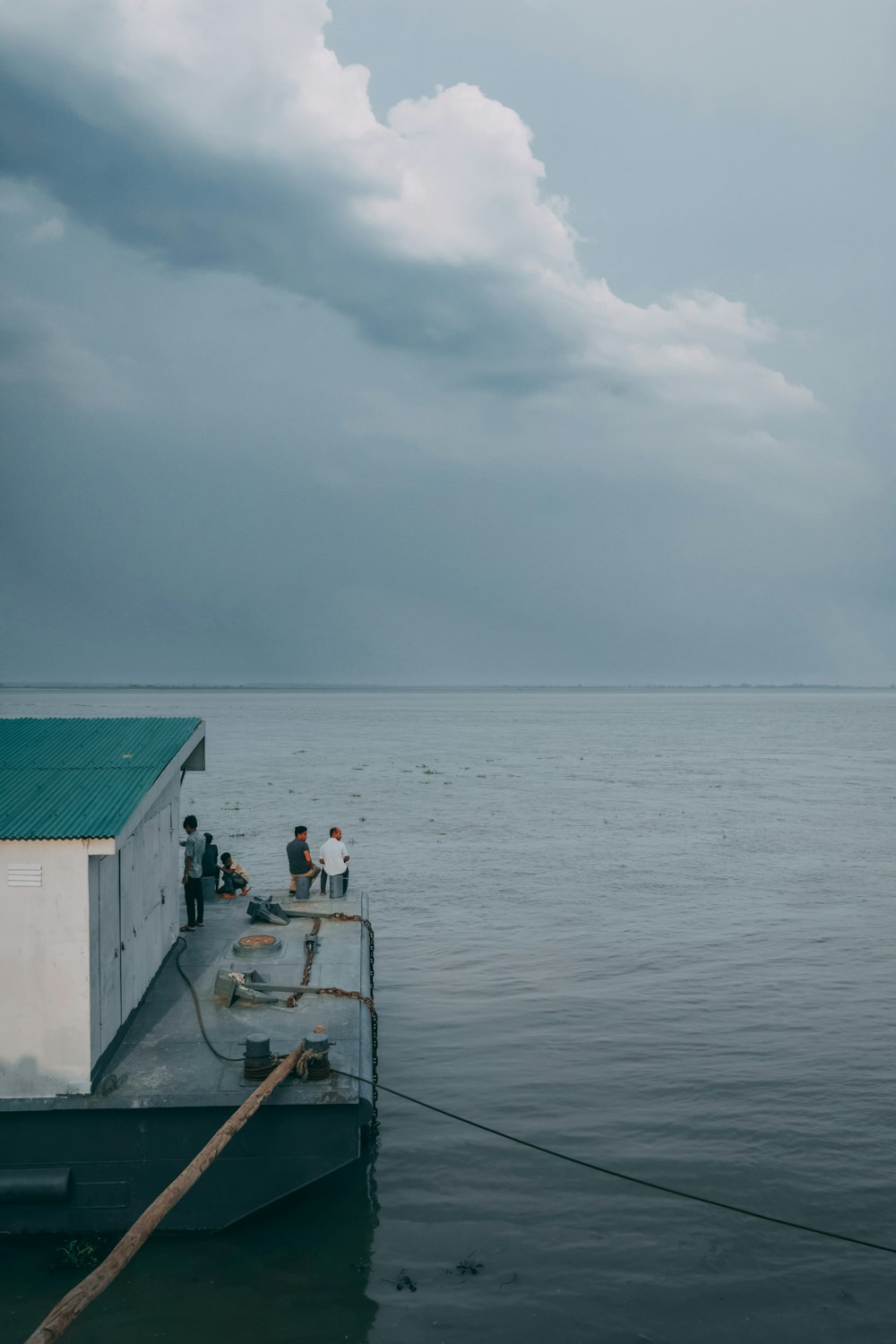 a group of people on a boat in the water