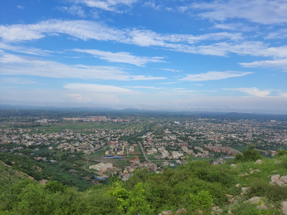 a view of a city from the top of a hill